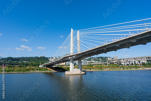 A wide-angle photo of the Tilikum Crossing Bridge as viewed from the Willamette River.