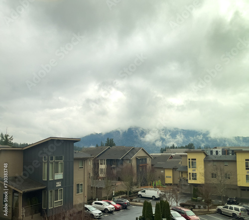 houses in the city on a cloiudy day © Brian