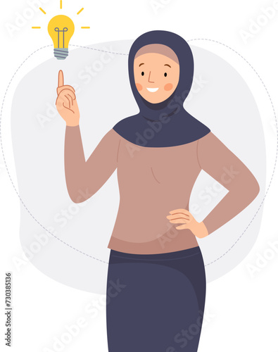 New idea concept. Muslim girl in hijab found a solution to the problem. Arabic woman pointing her finger at a light bulb. 