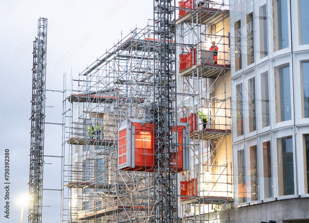 Industrial scaffolding lift working on facade scaffolding works