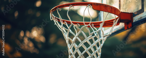 Urban Weathered basketball hoop close-up. Classic street basketball hoop with net, copy space. photo