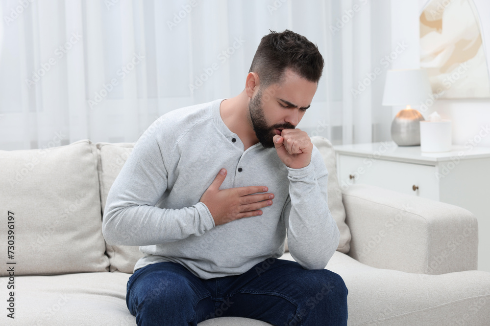 Sick man coughing at home. Cold symptoms Sick man coughing at home. Cold symptoms
