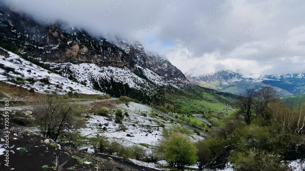 Tseylomsky pass in Ingushetia. A trip uphill to the Tsei Loam pass on a cloudy spring day. Panorama of the high cliffs of the Dzheyrakh gorge. North Caucasus, Russia. 4К Tseylomsky pass in Ingushetia. A trip uphill to the Tsei Loam pass on a cloudy spring day. Panorama of the high cliffs of the Dzheyrakh gorge. North Caucasus, Russia. 4К