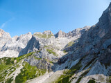 Panoramic view of majestic mountain peak Hoher Dachstein in Northern Limestone Alps, Styria, Austria. Scenic hiking trail in wilderness Austrian Alps. Peace of mind, calmness. Wanderlust in nature