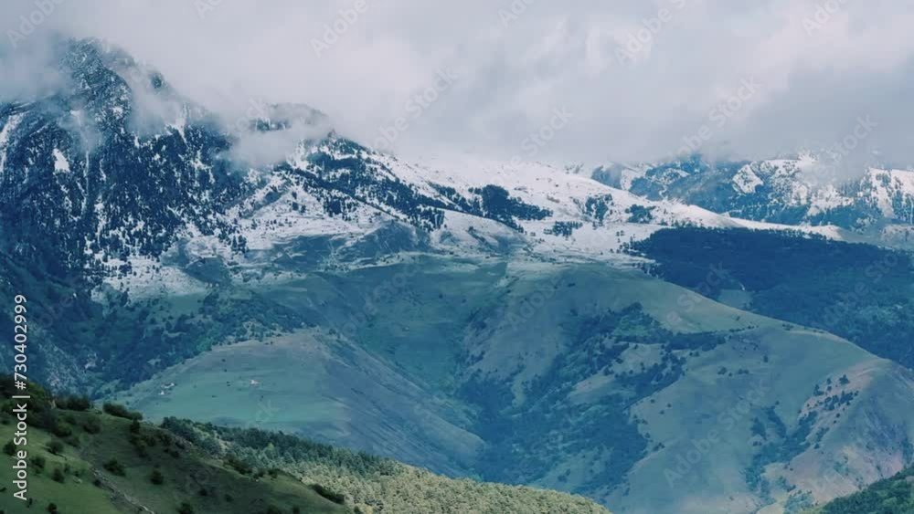 Tseylomsky pass in Ingushetia. A trip uphill to the Tsei Loam pass on a cloudy spring day. Panorama of the high cliffs of the Dzheyrakh gorge. North Caucasus, Russia. 4К Tseylomsky pass in Ingushetia. A trip uphill to the Tsei Loam pass on a cloudy spring day. Panorama of the high cliffs of the Dzheyrakh gorge. North Caucasus, Russia. 4К