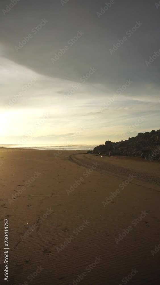 beautiful vertical video view of the sunrise on the beach with small waves, morning natural panorama on Karang Paranje beach, Garut beautiful vertical video view of the sunrise on the beach with small waves, morning natural panorama on Karang Paranje beach, Garut