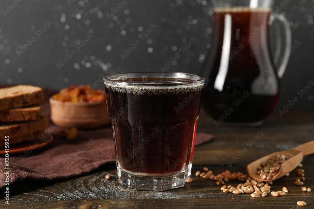 Glass of tasty kvass on table