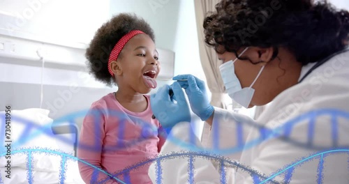 Animation of dna strands over african american female doctor taking swab test from girl patient photo