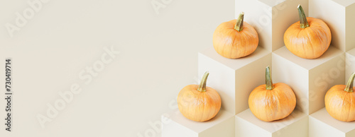 Pumpkins on Grey Colored Cubes. Fall themed Banner with copy-space.