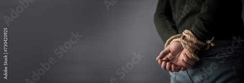Hands tied up with rope photo