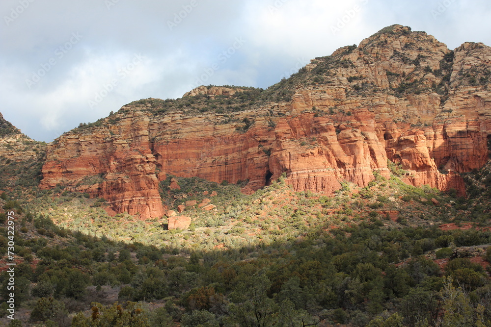 Beautiful views of the landscape of Sedona, Arizona in winter, with Sedona surrounded by red-rock buttes, steep canyon walls and pine forests