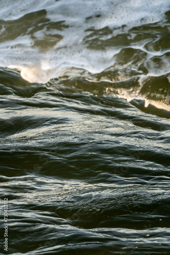 close up of the sea at sunset