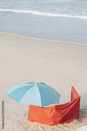 blue umbrella on a sandy beach