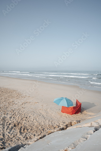 blue umbrella on a sandy beach