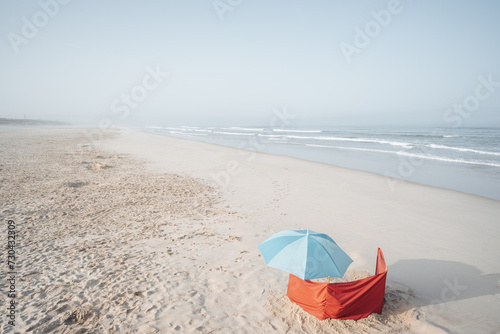 blue umbrella on a sandy beach