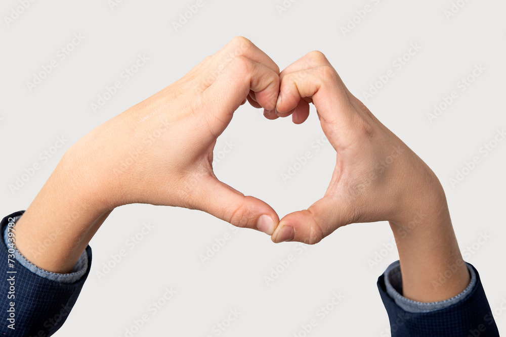 Hands forming a heart shape on a white background with copy space Hands forming a heart shape on a white background with copy space