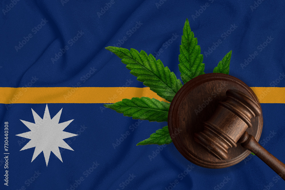 Judicial wooden gavel, fresh hemp leaf and flag of Nauru Illegal sale and distribution of marijuana