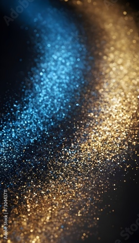 Background of abstract glitter lights. Gold  blue and black. De focused