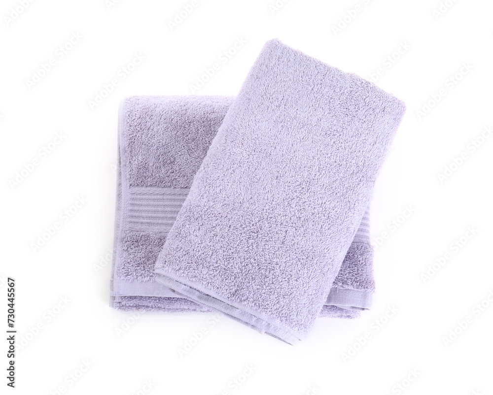 Folded violet terry towels isolated on white, top view Folded violet terry towels isolated on white, top view