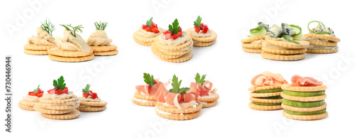 Delicious crackers with different toppings isolated on white, set