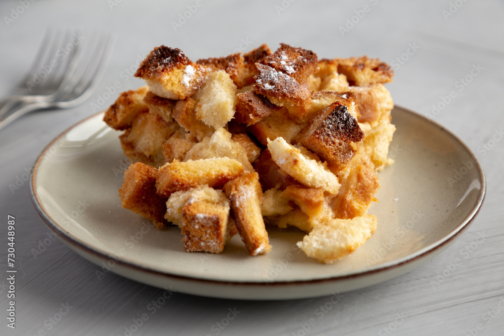 Homemade Bread Pudding on a Plate, side view. Close-up. Homemade Bread Pudding on a Plate, side view. Close-up.