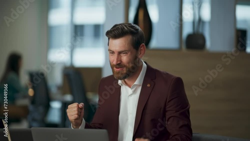 Euphoric businessman emotionally gesturing coworking space closeup. Boss waving photo