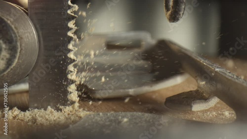 Slow motion 4k Video of a Jigsaw. closeup of wood chips flying away.