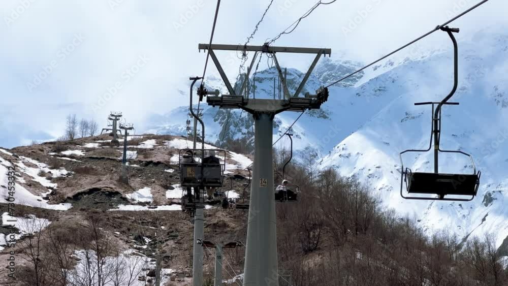 Cable car in the Tsey Gorge in spring, North Ossetia, Russia - May 2023: Tourists ride a cable car along the Tsey Gorge in North Ossetia, Caucasus, Russia. 4K Video Cable car in the Tsey Gorge in spring, North Ossetia, Russia - May 2023: Tourists ride a cable car along the Tsey Gorge in North Ossetia, Caucasus, Russia. 4K Video