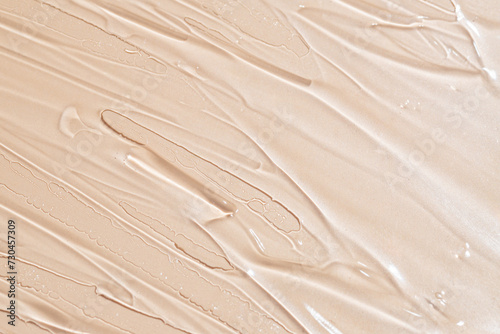 Close-up texture of creamy beige foundation photo