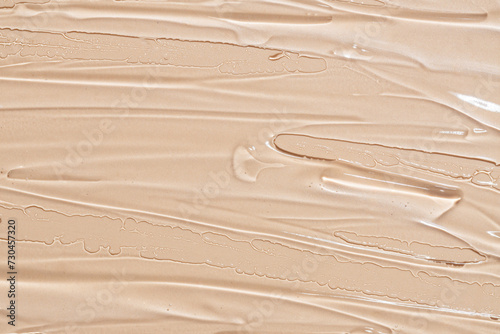 Close-up texture of creamy beige makeup foundation