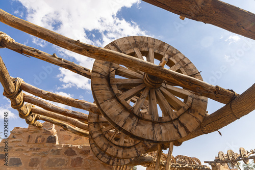 Ancient wheels for hoisting water at a desert oasis. photo