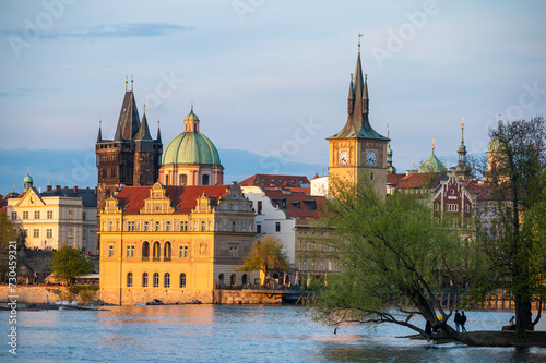 Old town of Prague. Czech Republic over river Vltava with Saint Vitus cathedral on skyline. Bright sunny day blue sky. Praha panorama landscape view. 