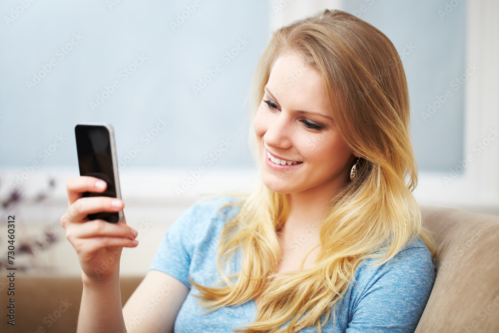 Young Woman with a Smart Phone on Sofa Young Woman with a Smart Phone on Sofa