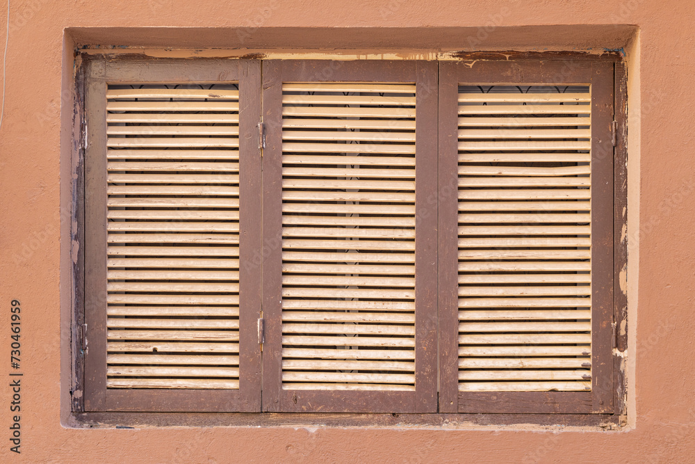 Wooden shuttered window in old town Al-Ula.