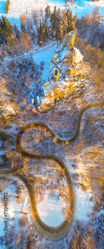 Frydstejn medieval castle ruins at cold morning sunrise time. Bohemian Paradise, Czech: Cesky raj, Czechia. Aerial view from above. photo