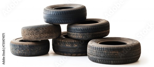 Old dirty car tires stacked isolated on white background. AI generated image