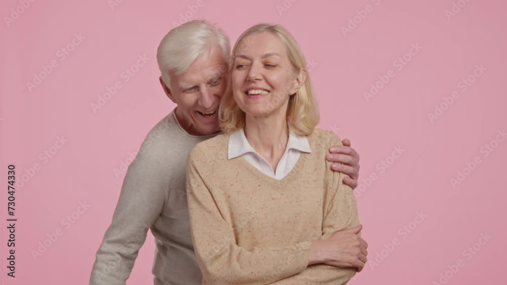 happy adult married couple giving a gift for Valentine's Day happy adult married couple giving a gift for Valentine's Day