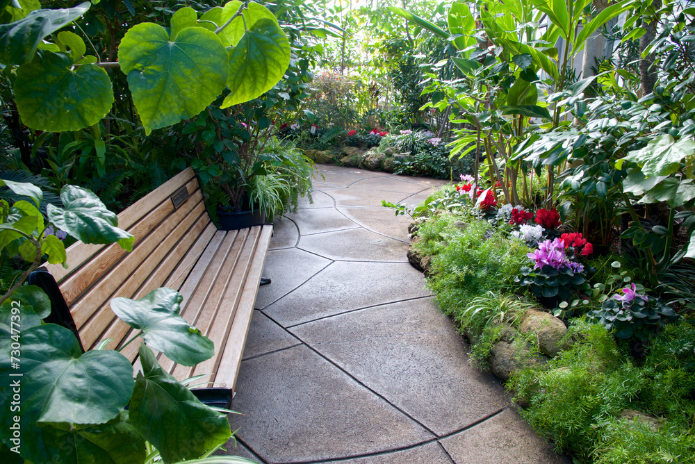 Obraz premium A park bench inside a conservatory.