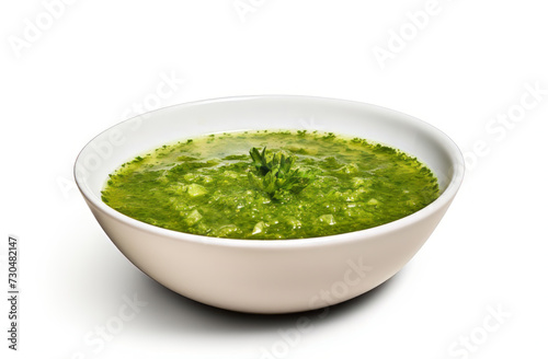 Bowl of vegetable soup with parsley isolated on a white background