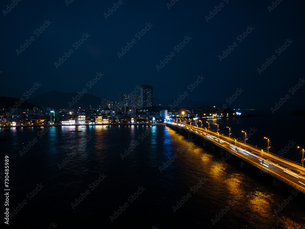 Fototapeta premium Top view aerial video of Nha Trang city at night. 4K