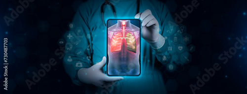 Color image of the lungs on an x-ray. The doctor studies and analyzes tuberculosis, lung cancer, tuberculosis and lung cancer. Scene of a doctor with tablet on digital and technological background. photo