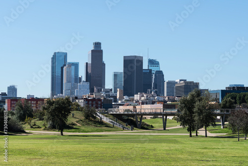 Downtown Los Angeles skyline with urban park in foreground. 