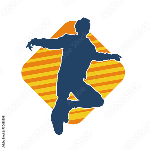 Silhouette of a male dancer in performing pose. Silhouette of a dancing man.
