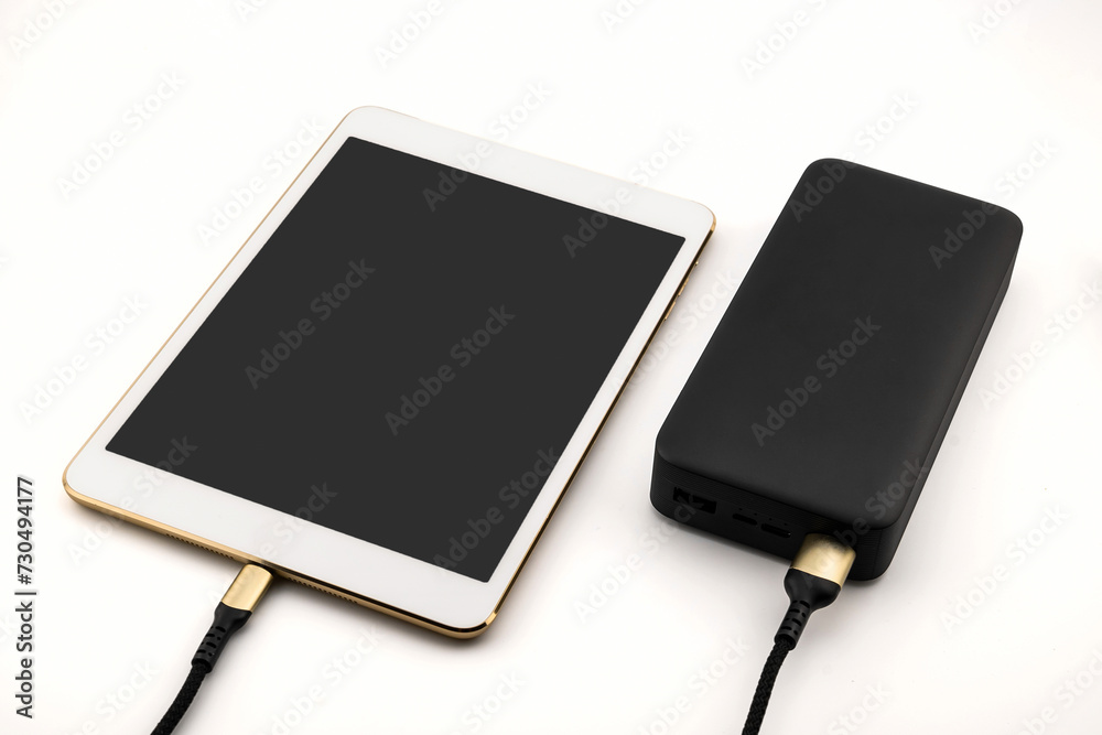 Tablet and portable battery close-up Tablet and portable battery close-up