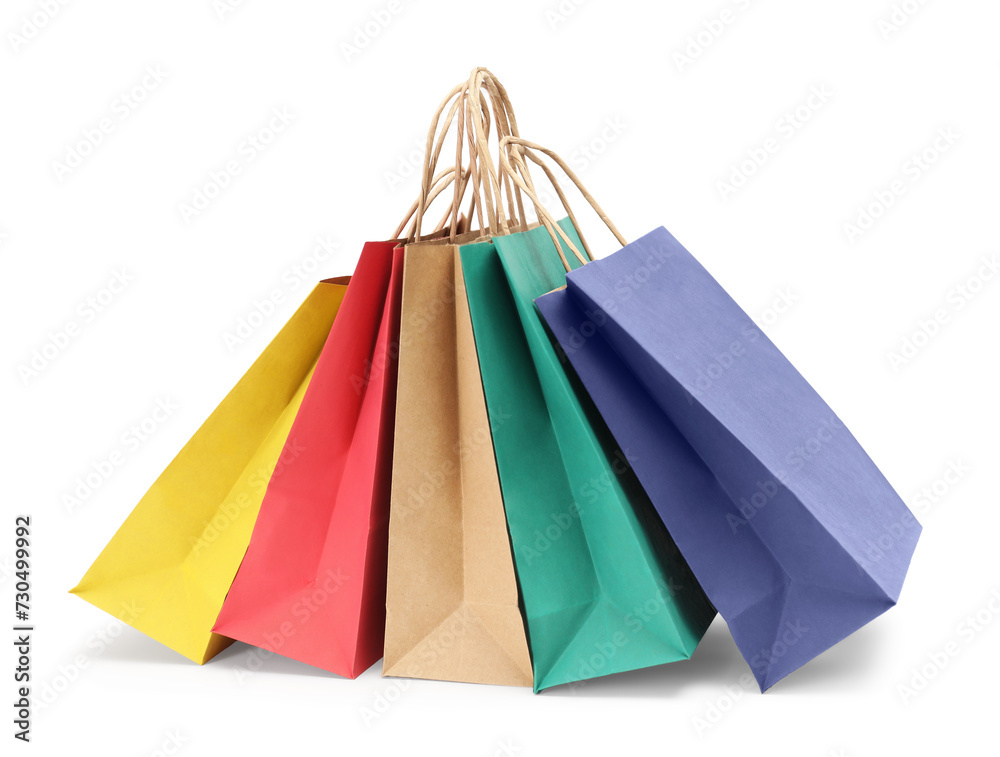 Colorful and kraft paper shopping bags isolated on white