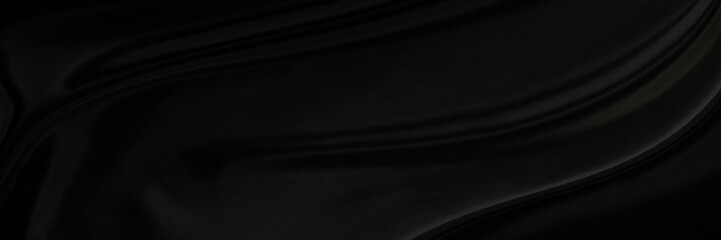 Black gray satin dark fabric texture luxurious shiny that is abstract silk cloth panorama background with patterns soft waves blur beautiful.