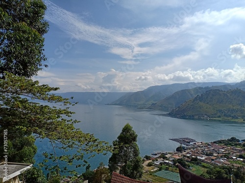"Experience Tranquility at Lake Toba, Indonesia's Largest Volcanic Lake. Nestled amidst the lush landscapes of North Sumatra.