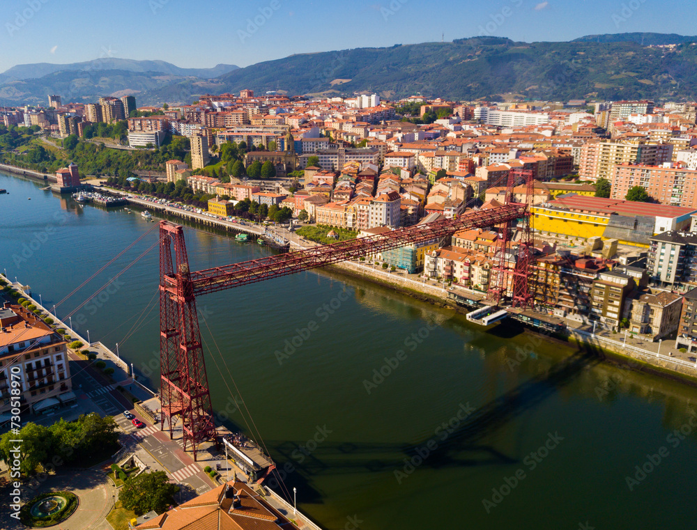 Aerial view of Vizcaya bridge over the river and cityscape at Portugalete, Spain