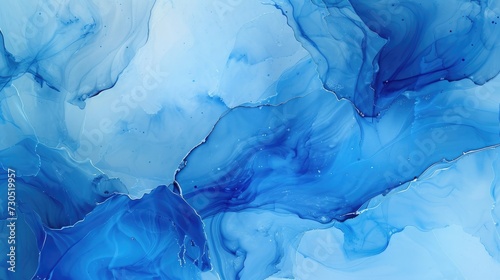 Marble liquid ink art painting on paper with an abstract background in shades of ocean blue.