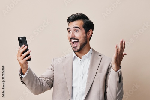 man smile happy portrait business suit hold cellphone smartphone phone call